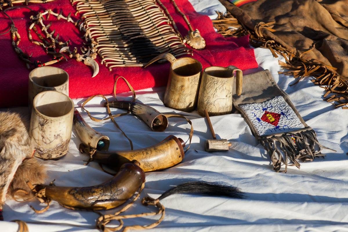 A market table of handmade baskets and pottery